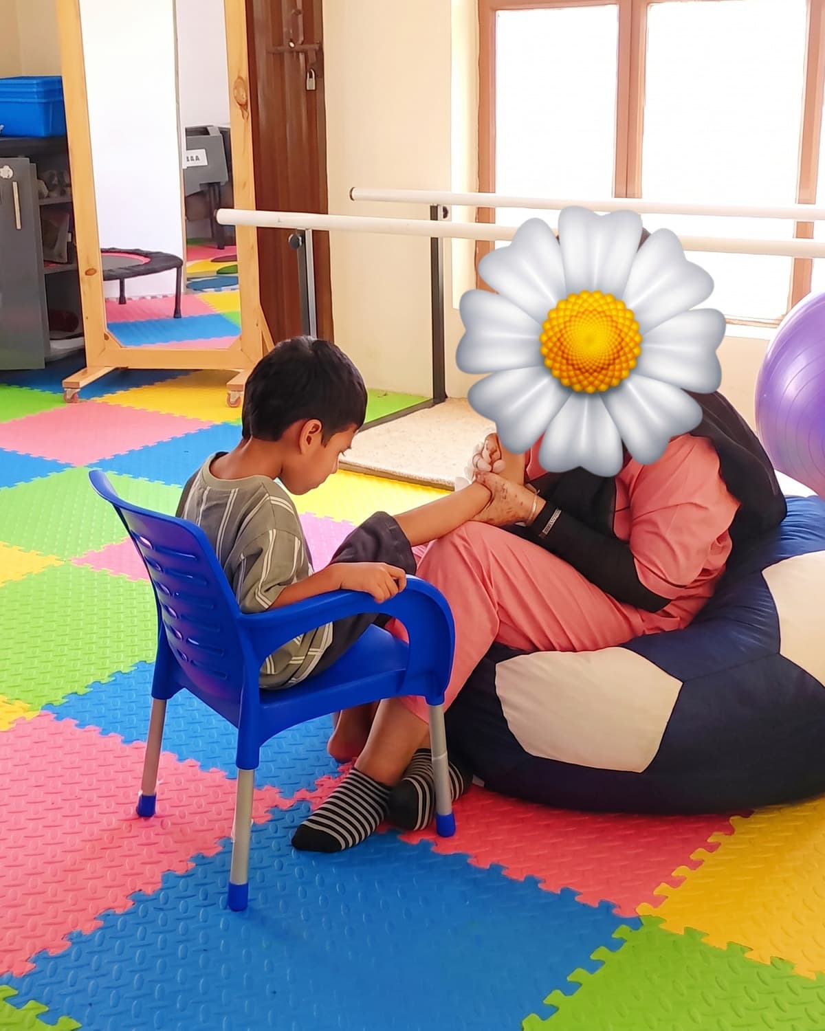 A child settling into a bean bag in the sensory room