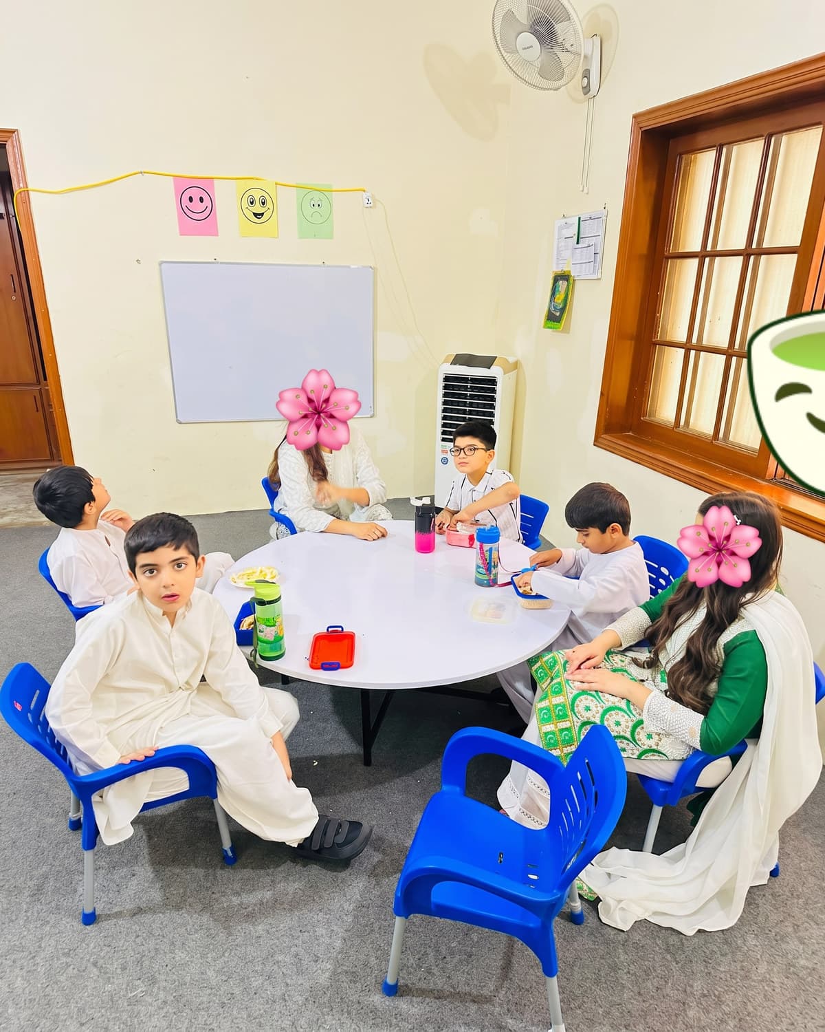 Children gathered around the table for a group activity